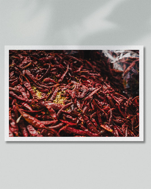 Framed presentation of a dense field of dried red chillies photographed in Phuket