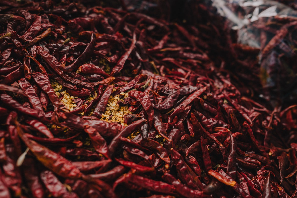 a dense field of dried red chillies photographed in Phuket, photographed by Mitchel Lensink