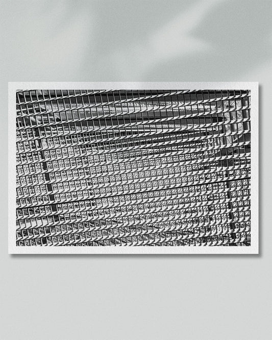 Framed presentation of repeating architectural lines rendered in black and white